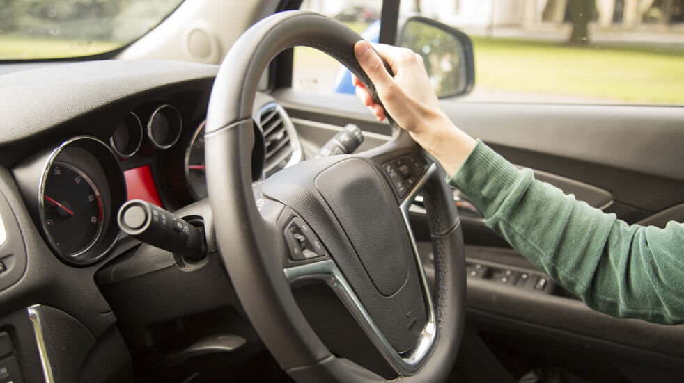 Save money new driver; hand on the wheel